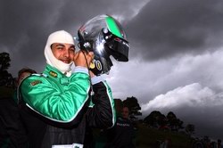 Adam Khan against a glowering sky, on duty for A1 Team Pakistan in Australia