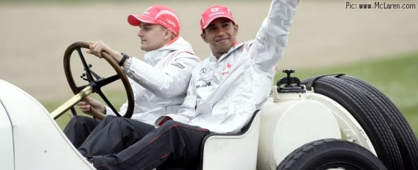 Heikki Kovalainen and Lewis Hamilton parade in a vintage McLaren