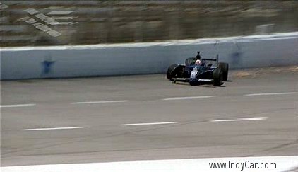 Wheldon's car bounces back from the wall