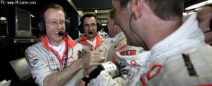 McLaren crew celebrate Heikki Kovalainen\'s pole