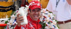 Helio celebrates in Victory Lane with the traditional winner's drink of milk