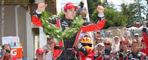Justin Wilson celebrates his victory at the Glen
