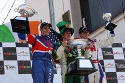 Brit Olly Jarvis and Ireland's Adam Carroll celebrate on the feature race podium