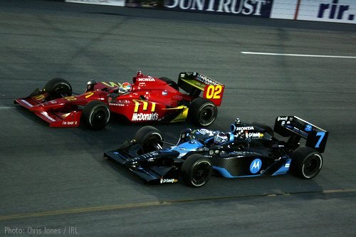 Justin Wilson and Danica Patrick race wheel-to-wheel