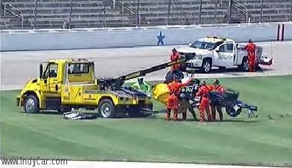 A recovery crew lifts the wreckage