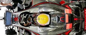 Lewis Hamilton studies data in his garage