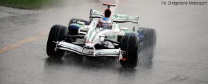 Jenson Button splashes through first practice