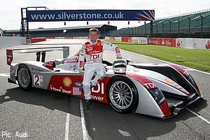 McNish poses with his race-winning Audi