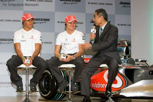 Bridgestone motorsport director Hiroshi Yasukawa interviews Lewis Hamilton and Heikki Kovalainen