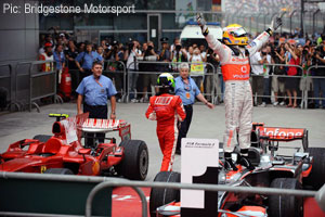 The winner and the runner-up: Hamilton celebrates, Massa departs