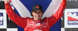Dario Franchitti flies the flag after victory at Long Beach