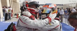 Jarno Trulli and Timo Glock celebrate their front row qualifying