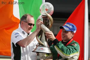 Irish boss Mark Gallagher, driver Adam Carroll and a very big trophy