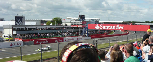 Jenson Button hits the start/finish straight in practice