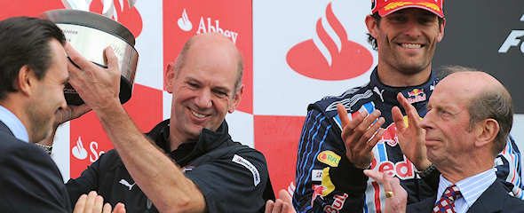 Red Bull designer Adrian Newey accepts the constructors' trophy at Silverstone