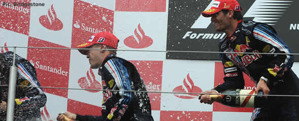 Mark Webber celebrates his first victory