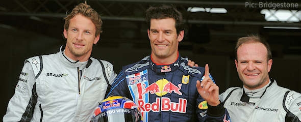 Mark Webber celebrates earning pole