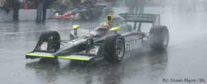 Dan Wheldon braves the morning storm