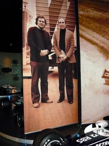 Patrick Head (with holes in shoes) and Frank Williams