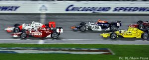 Ryan Briscoe crosses the line ahead of Scott Dixon, Mario Moraes, Dario Franchitti and Graham Rahal