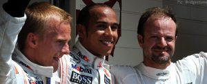 Kovalainen, Hamilton and Barrichello celebrate their performances