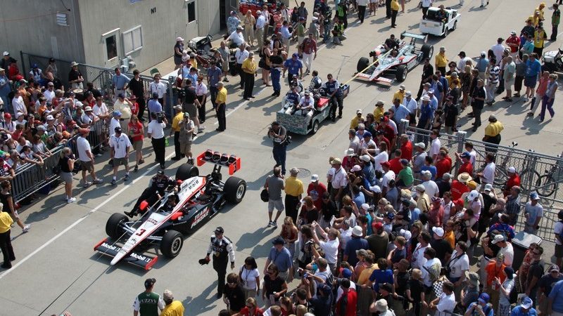 The cars are towed to the track