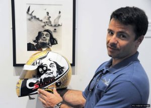 Oriol Servia shows off the inspiration for his race helmet