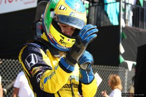 Ana Beatriz checks her wrist brace before the race