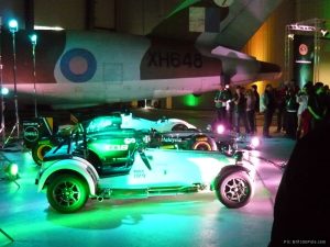 Caterhams and the Team Lotus F1 car on display in a Duxford hanger