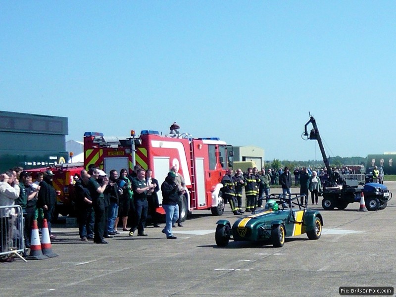 Fernandes and other members of the Team Lotus family congratulate Kovalainen on his display