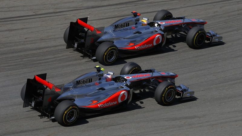 Lewis Hamilton and Jenson Button race each other
