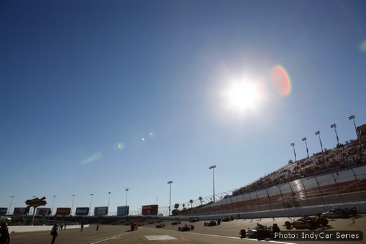 The pitiless Nevada sun beats down as spectators and race crews watch 19 IndyCars salute Dan Wheldon